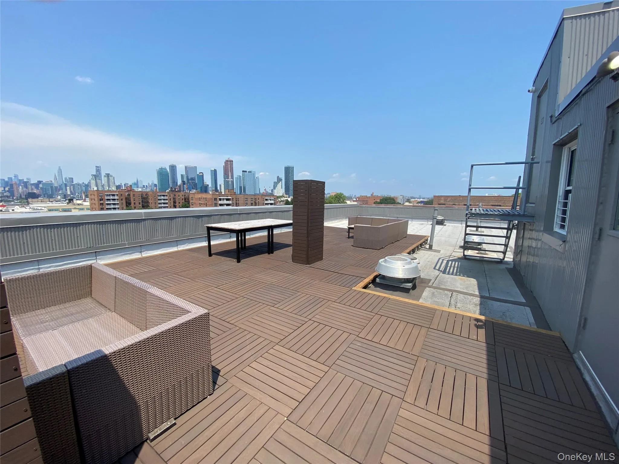 View of patio / terrace with an outdoor hangout area and a skyline view View of patio / terrace with an outdoor hangout area and a skyline view