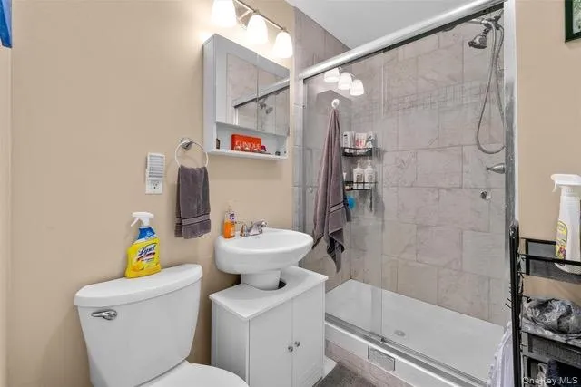 Full bath featuring vanity and a stall shower Full bath featuring vanity and a stall shower