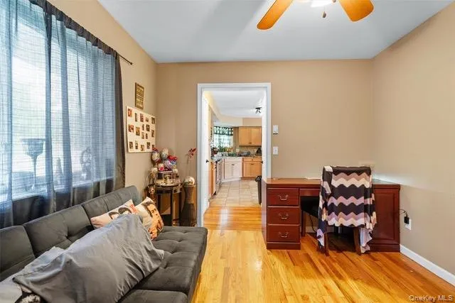 Office area featuring light wood-style floors and ceiling fan Office area featuring light wood-style floors and ceiling fan