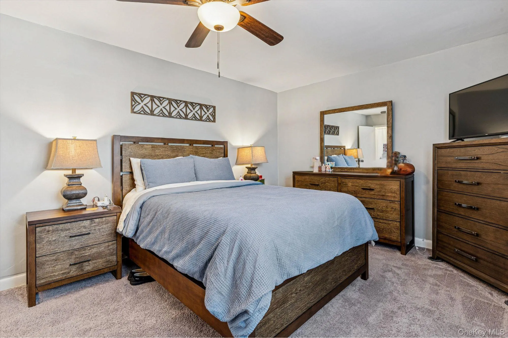 Bedroom with carpet floors and ceiling fan Bedroom with carpet floors and ceiling fan