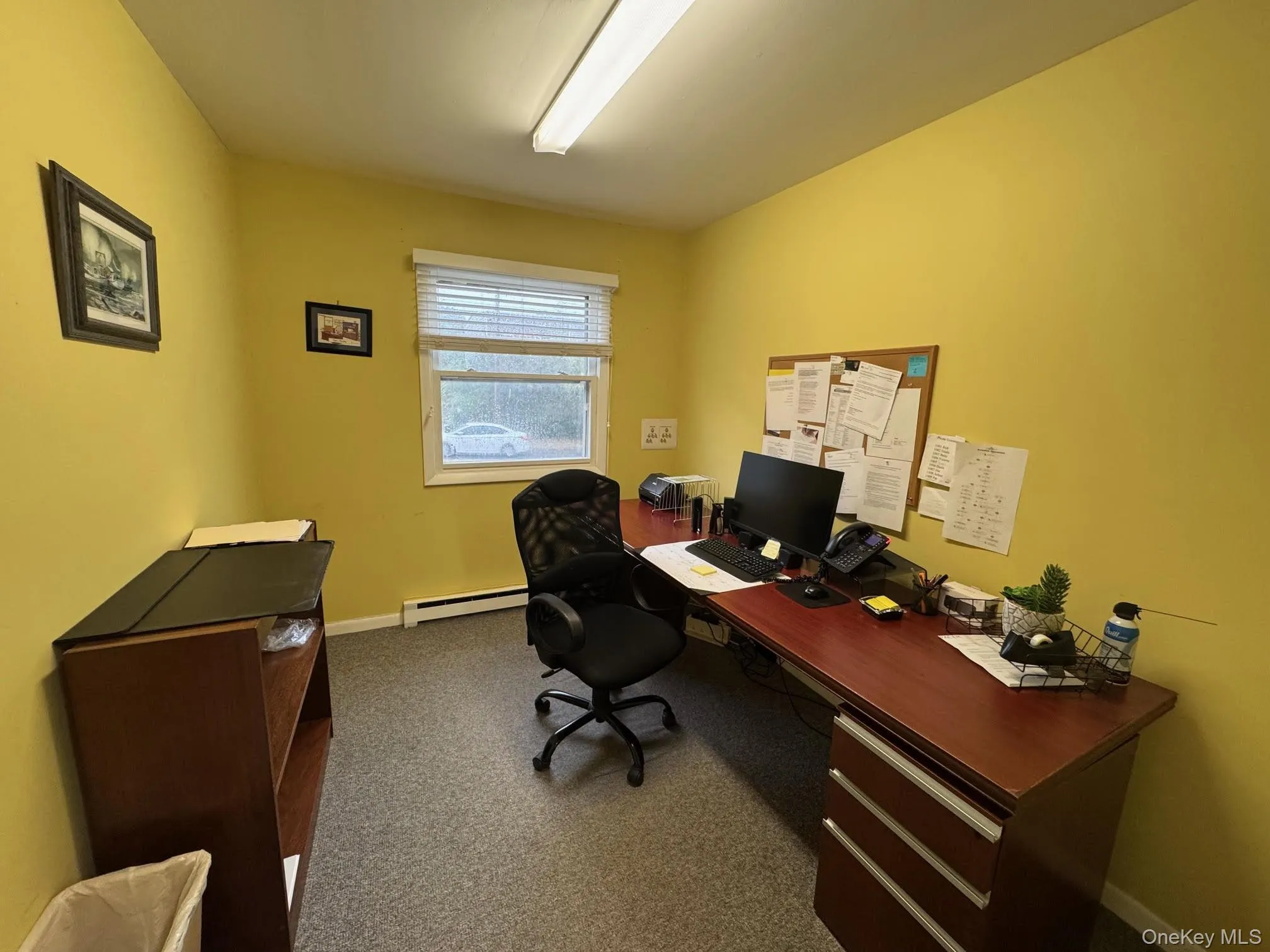 Office area featuring dark colored carpet Office area featuring dark colored carpet