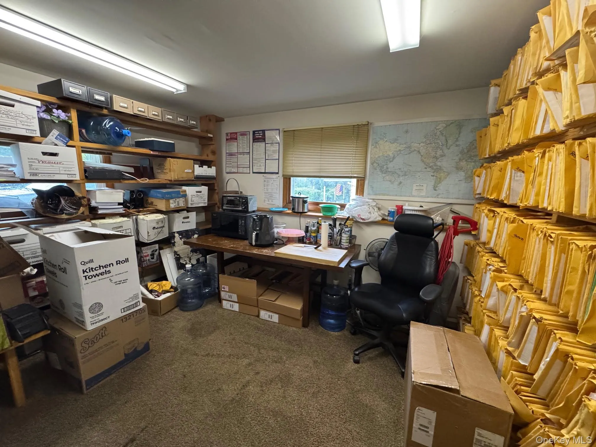 Office with dark colored carpet Office with dark colored carpet