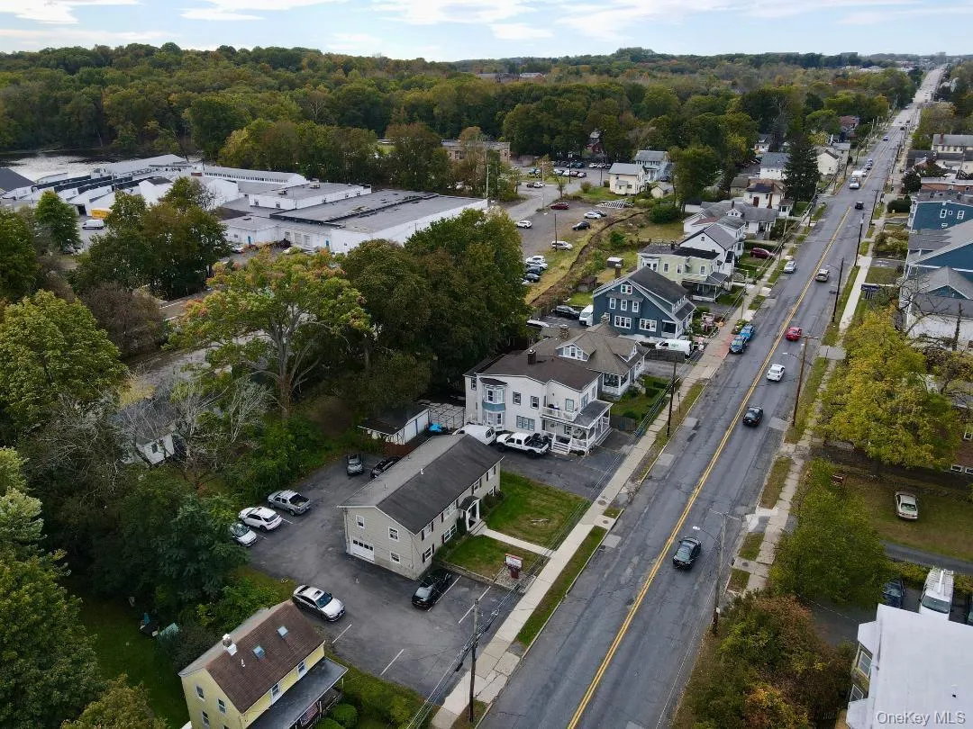 Aerial overview of property's location with nearby suburban area Aerial overview of property's location with nearby suburban area