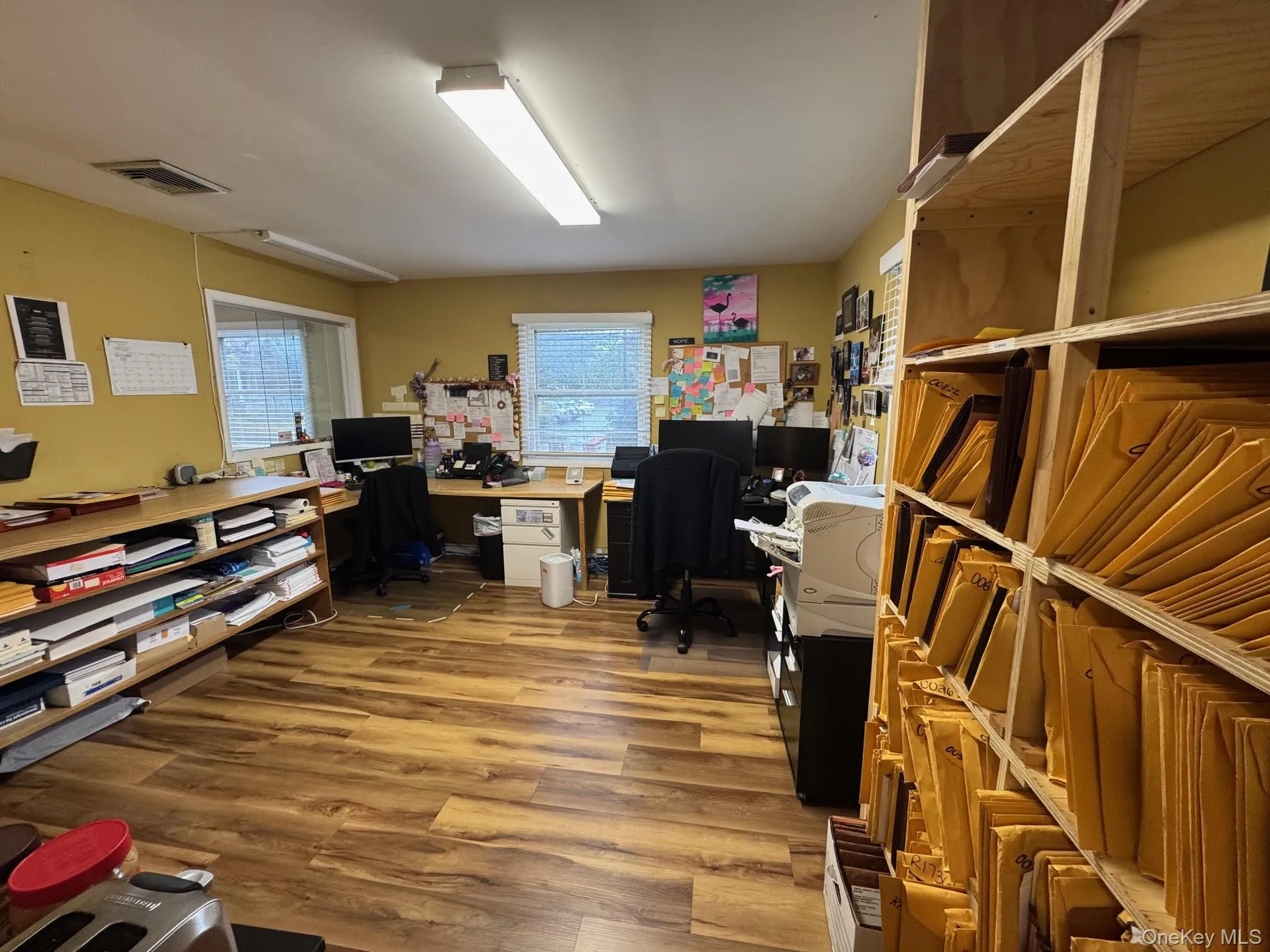 Office space with light wood-type flooring Office space with light wood-type flooring