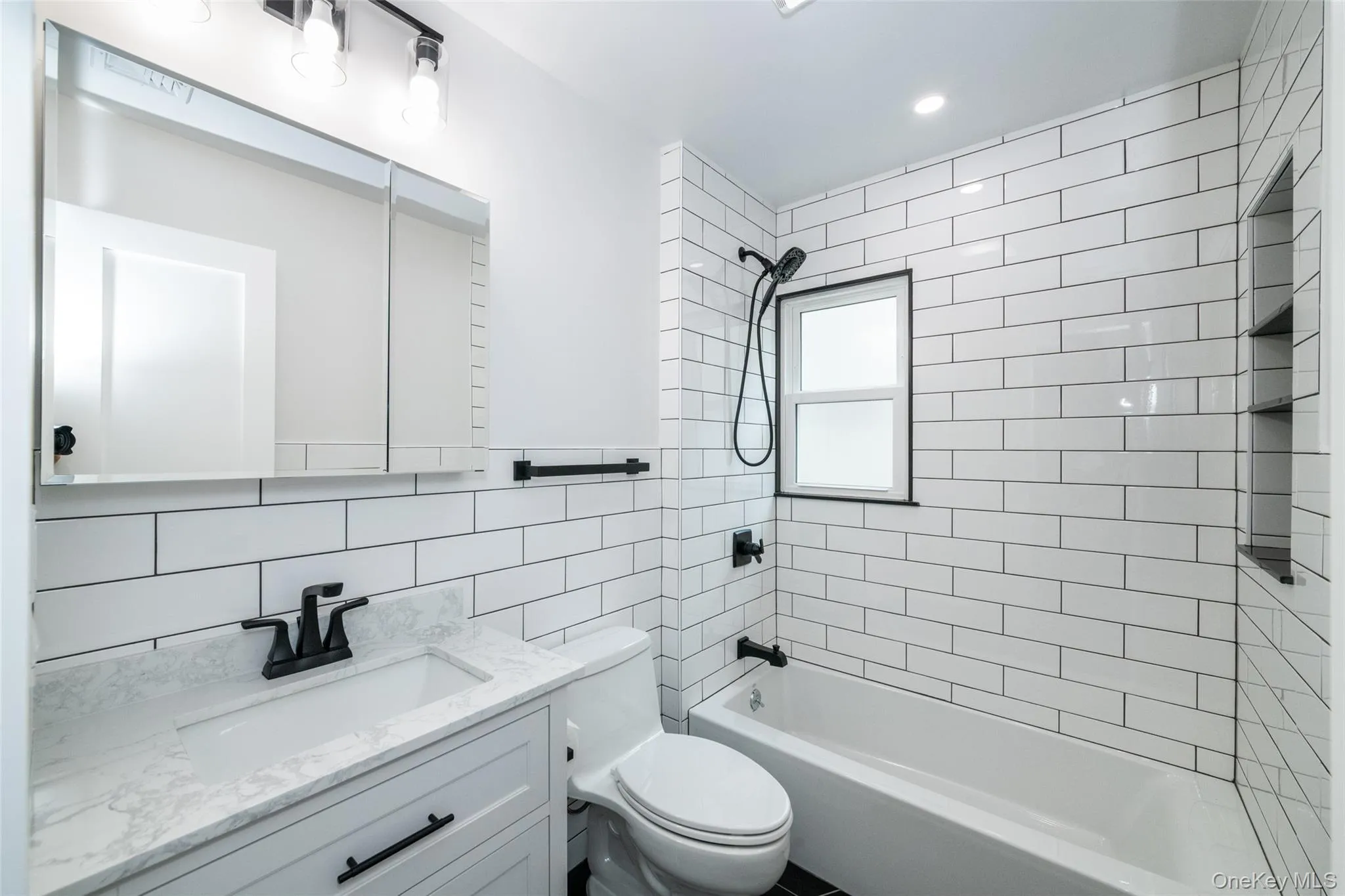 Full hallway bathroom with bathtub / shower Full hallway bathroom with bathtub / shower