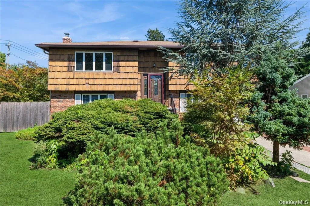 Raised ranch with brick siding and a chimney Raised ranch with brick siding and a chimney