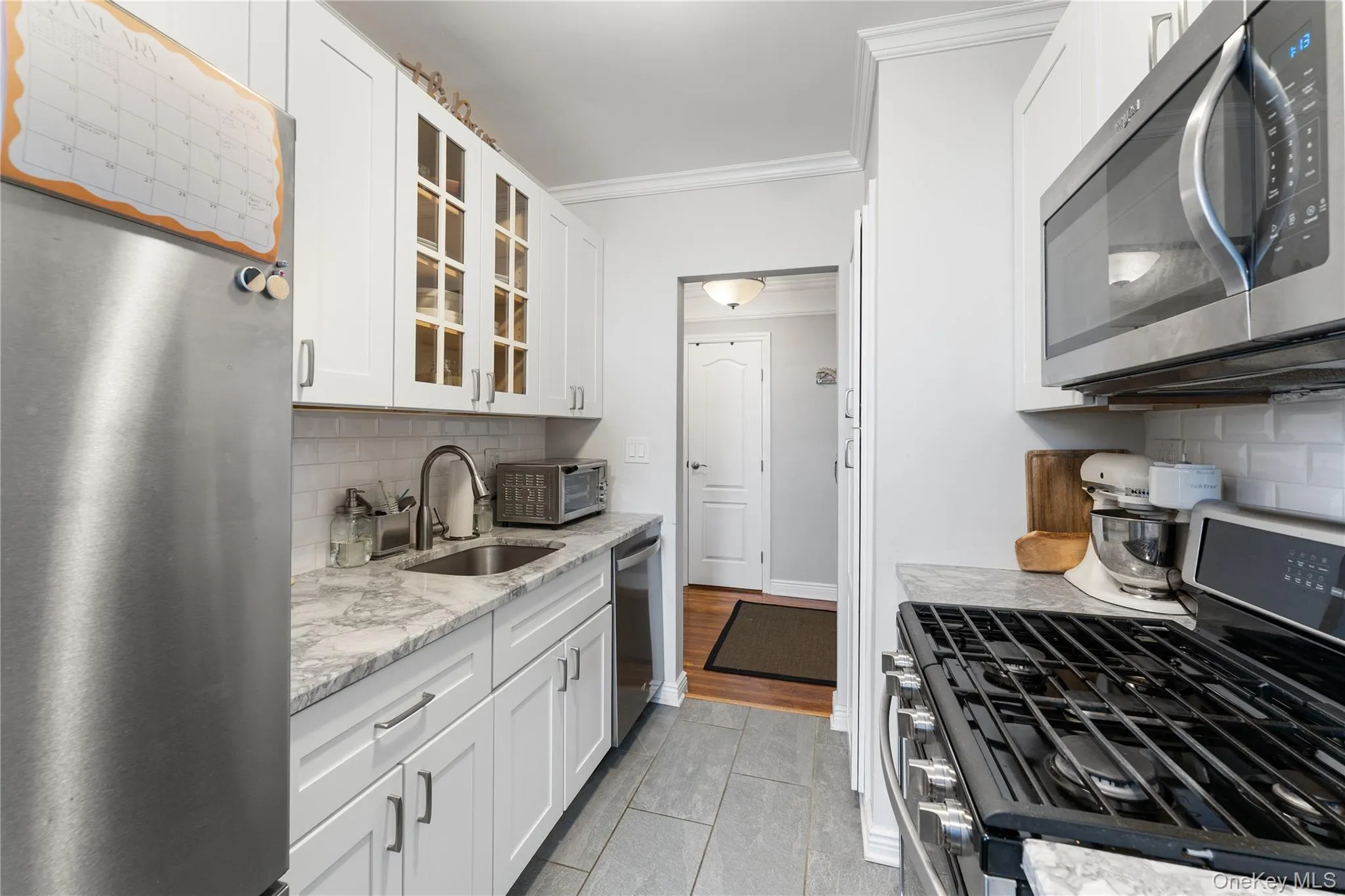 Alternate view of fully renovated kitchen (2018) looking toward entry foyer Alternate view of fully renovated kitchen (2018) looking toward entry foyer