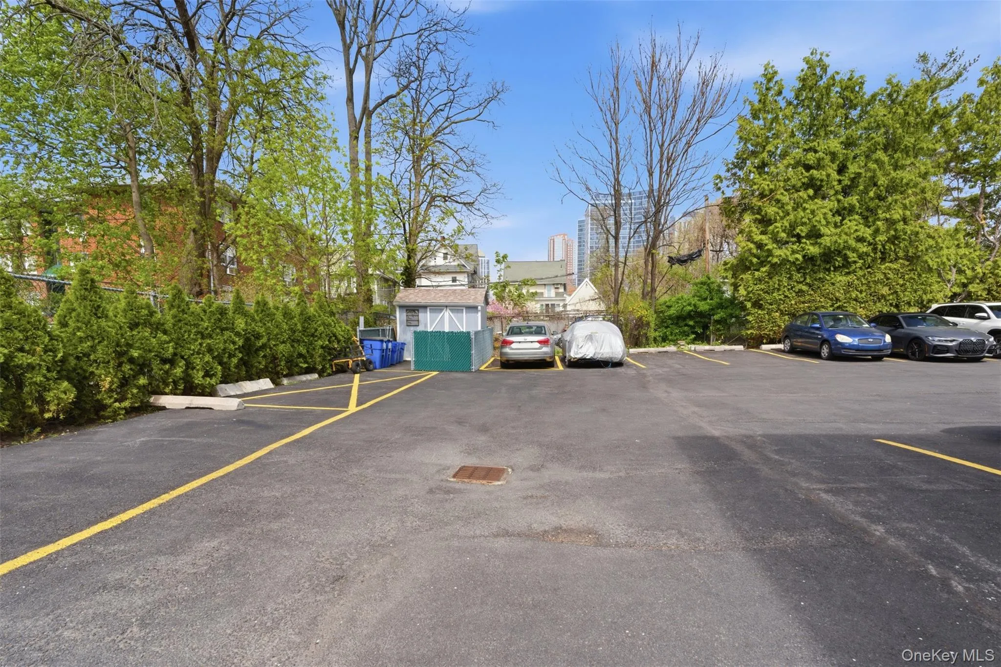 Paved parking area- unit comes with one deeded parking spot. Paved parking area- unit comes with one deeded parking spot.
