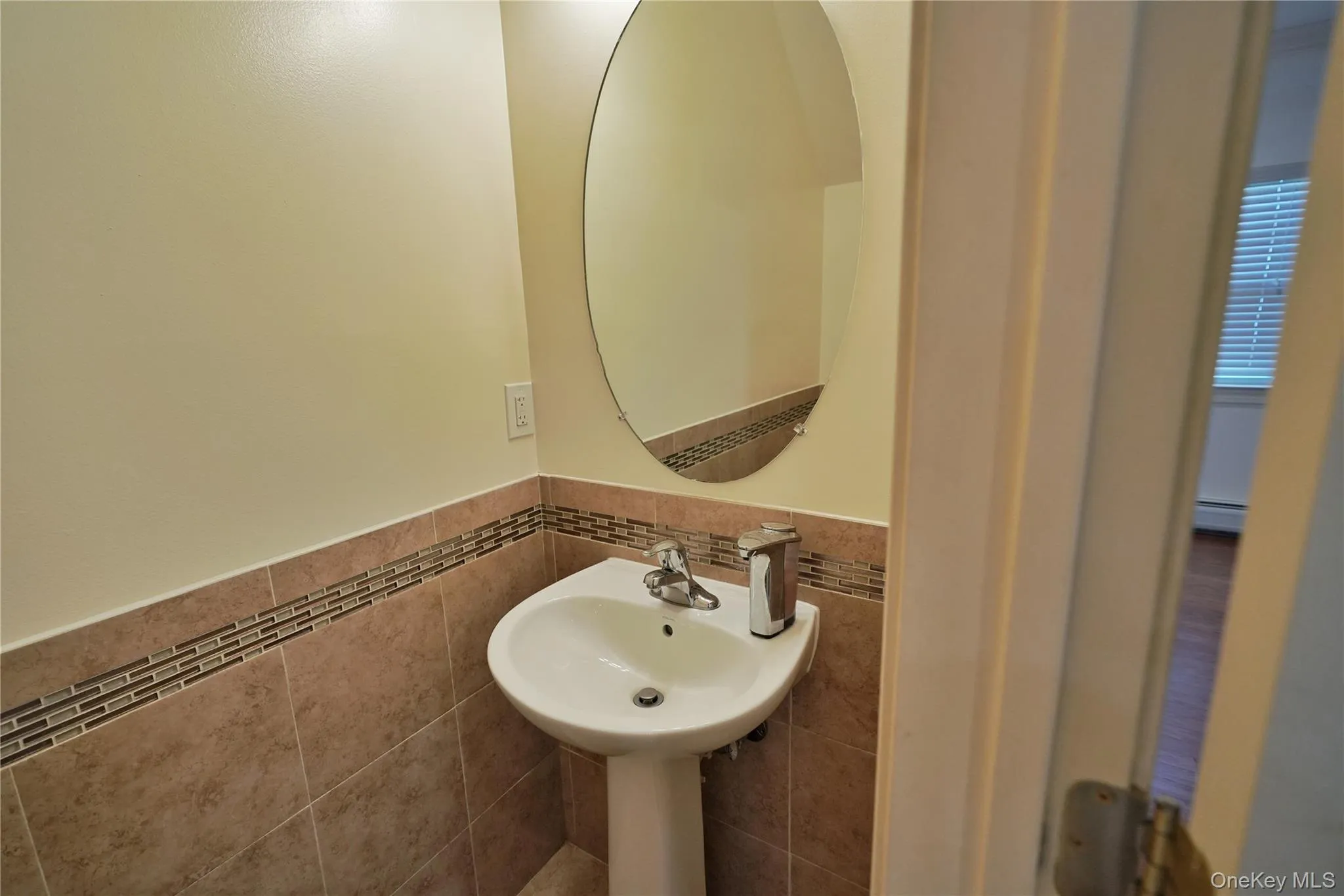 1st floor powder room w/ mirror. 1st floor powder room w/ mirror.