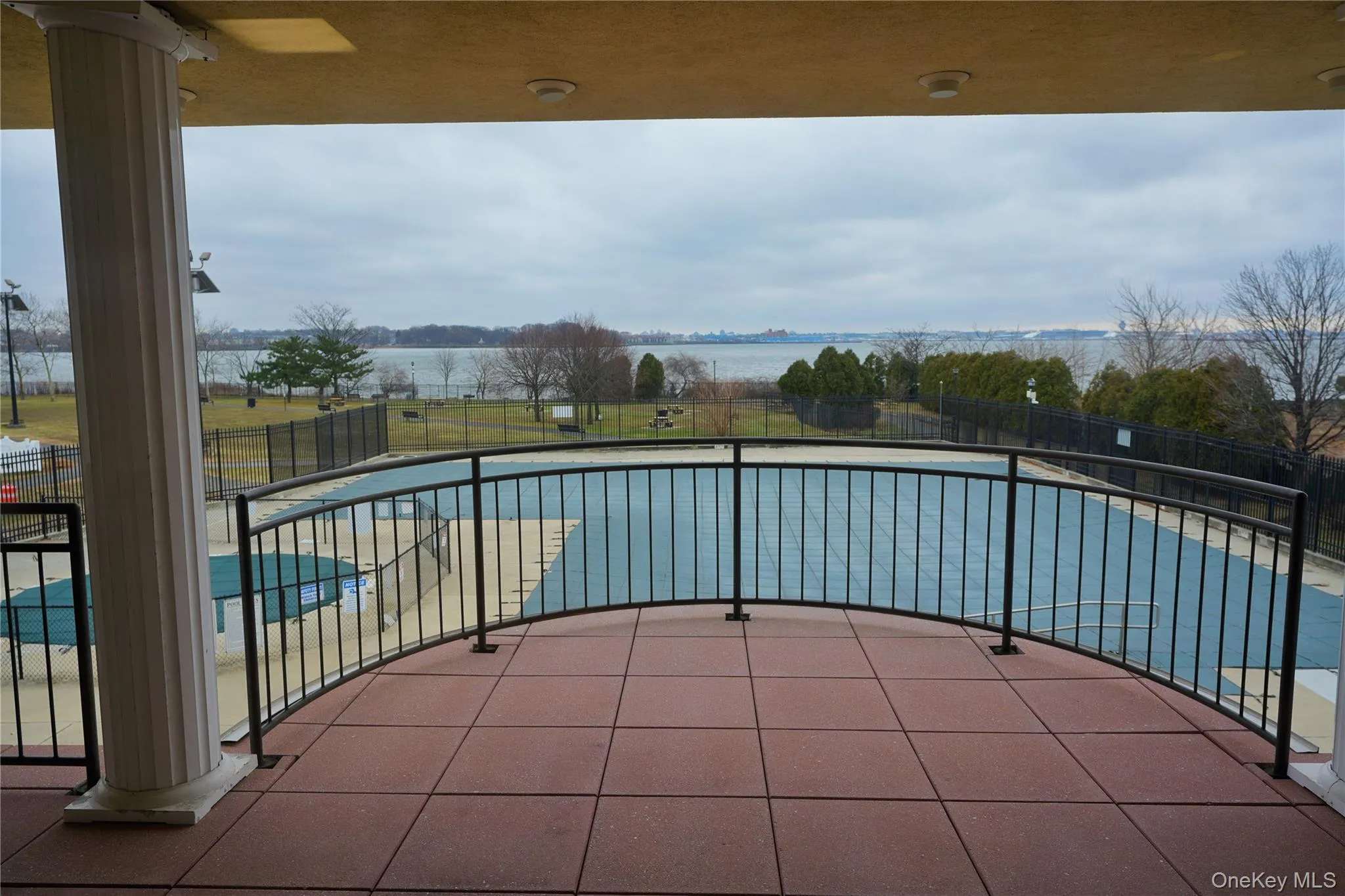 Water view from clubhouse balcony overlooking swimming pool and East River. Water view from clubhouse balcony overlooking swimming pool and East River.