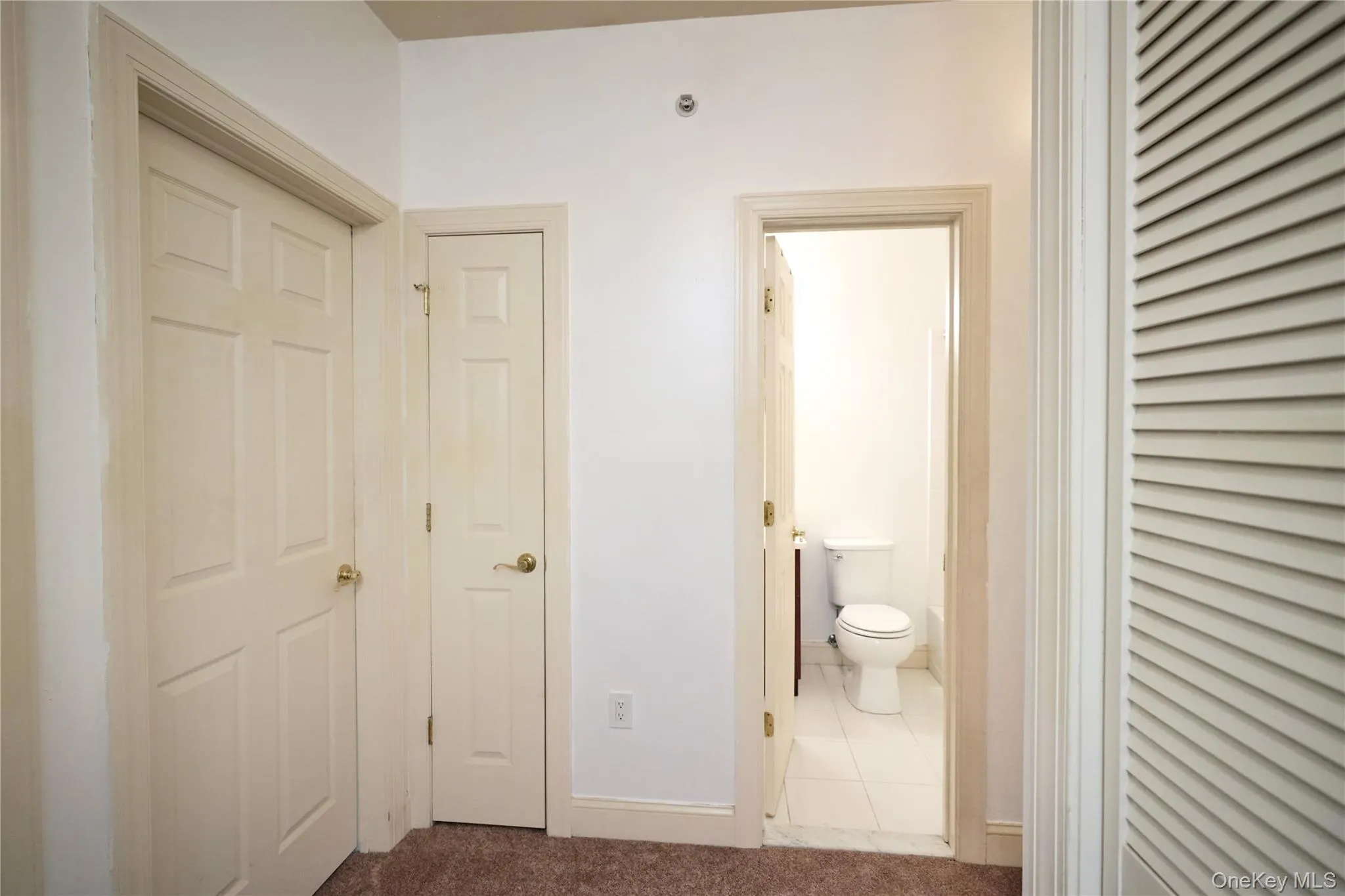 2nd floor hallway featuring brand new carpeting and hall bathroom. 2nd floor hallway featuring brand new carpeting and hall bathroom.