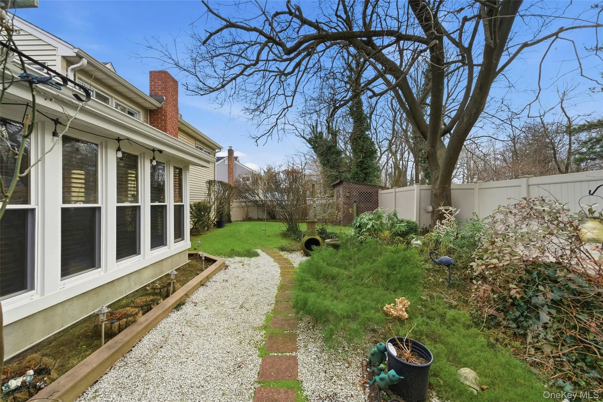 Fenced backyard with a garden Fenced backyard with a garden