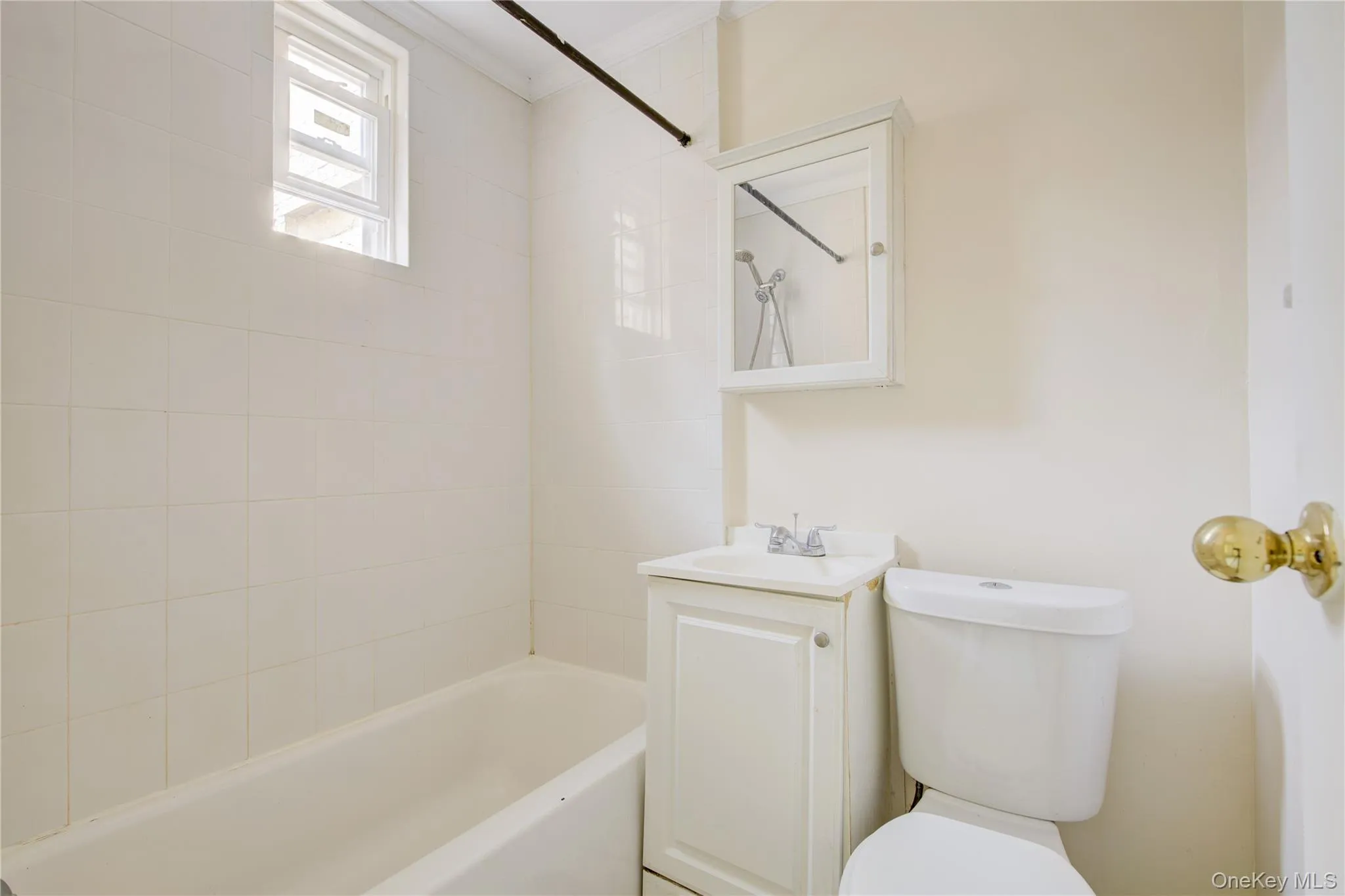 Full bath with vanity, bathing tub / shower combination, and crown molding Full bath with vanity, bathing tub / shower combination, and crown molding