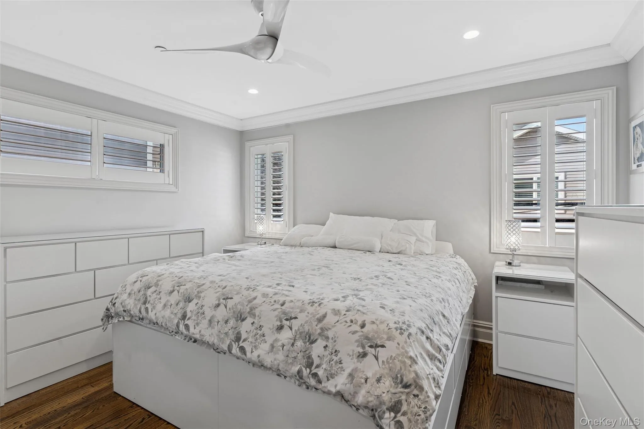Bedroom featuring crown molding, dark wood-type flooring, a ceiling fan, and recessed lighting Bedroom featuring crown molding, dark wood-type flooring, a ceiling fan, and recessed lighting