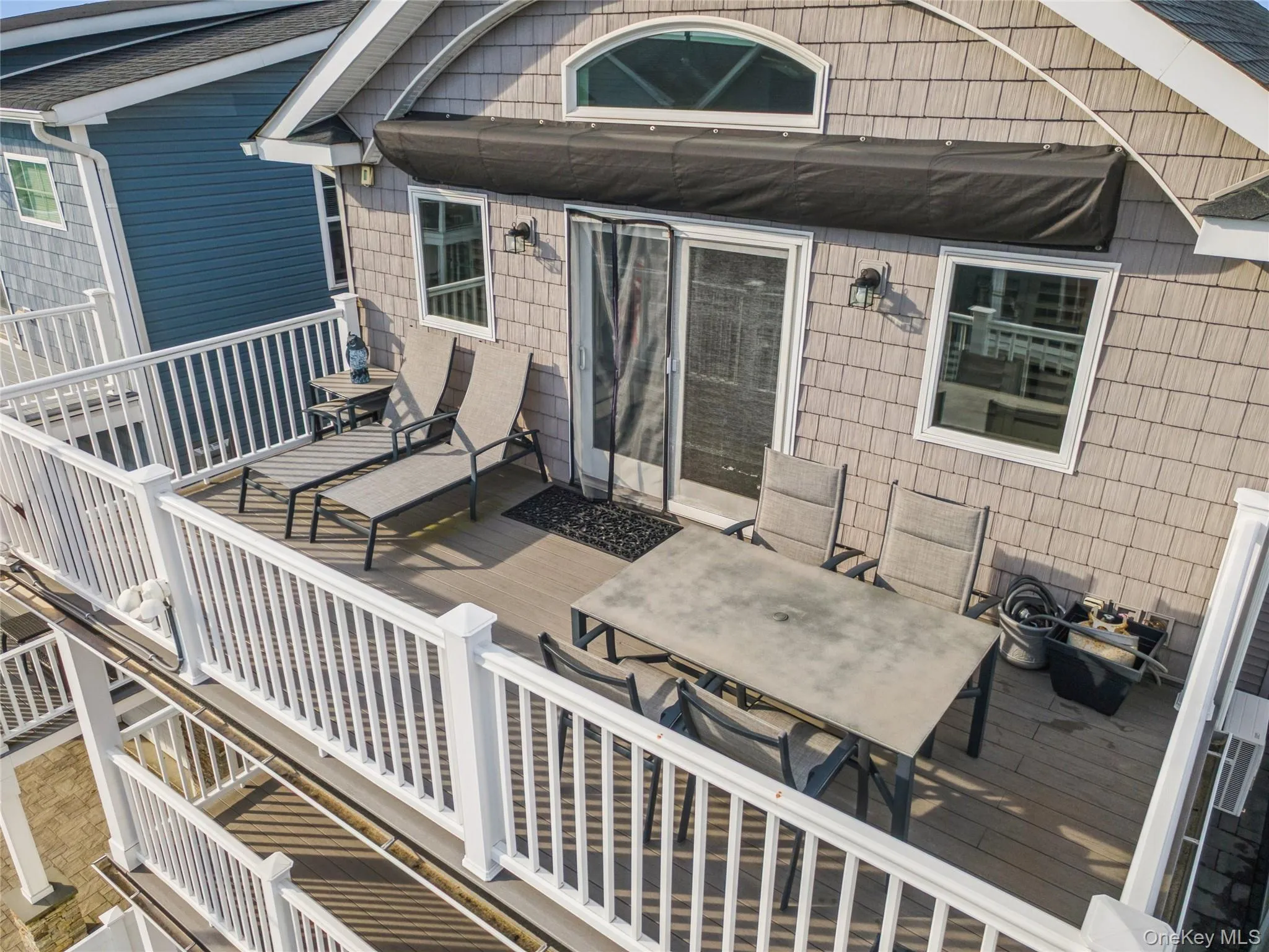 Wooden terrace featuring outdoor dining area Wooden terrace featuring outdoor dining area