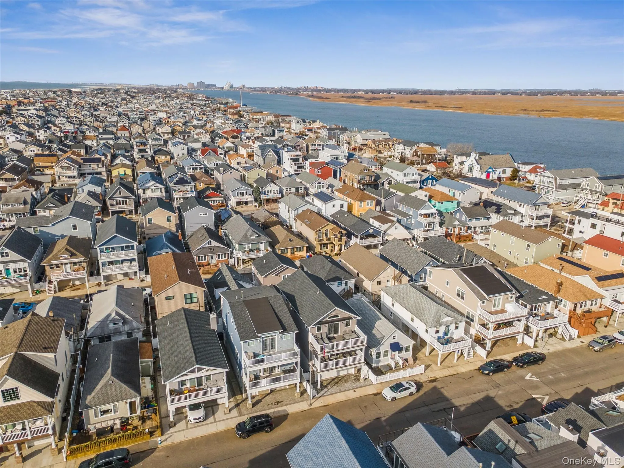 Aerial view of residential area featuring a nearby body of water Aerial view of residential area featuring a nearby body of water
