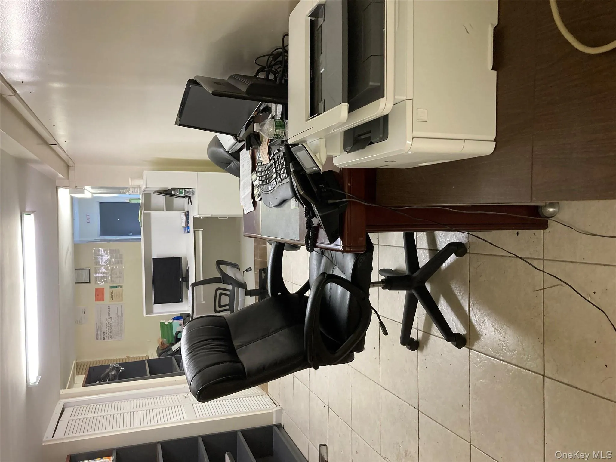 Office area with light tile patterned flooring Office area with light tile patterned flooring