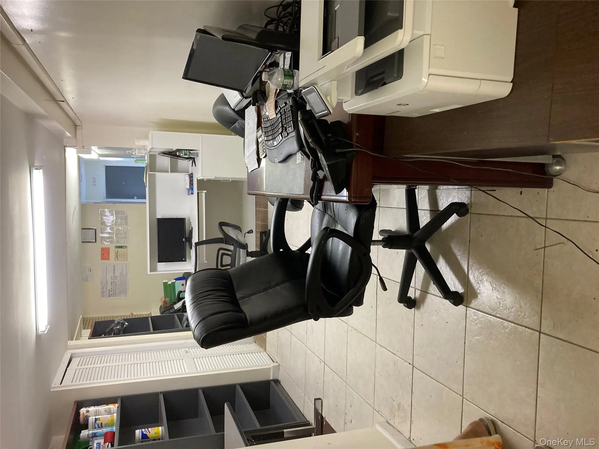 Office area with light tile patterned floors Office area with light tile patterned floors