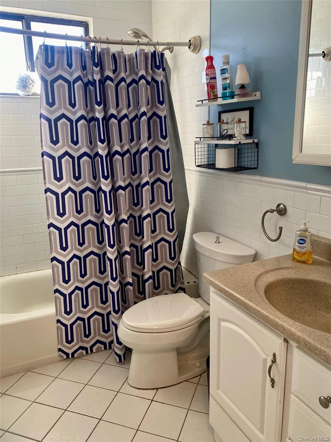 The full bathroom with a tub & shower combo The full bathroom with a tub & shower combo