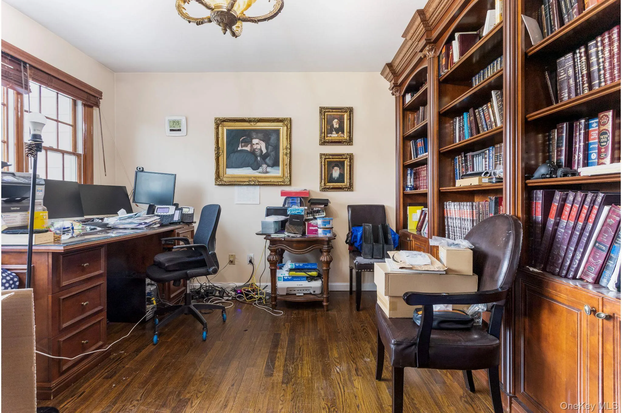 Office area with dark wood finished floors and baseboards Office area with dark wood finished floors and baseboards