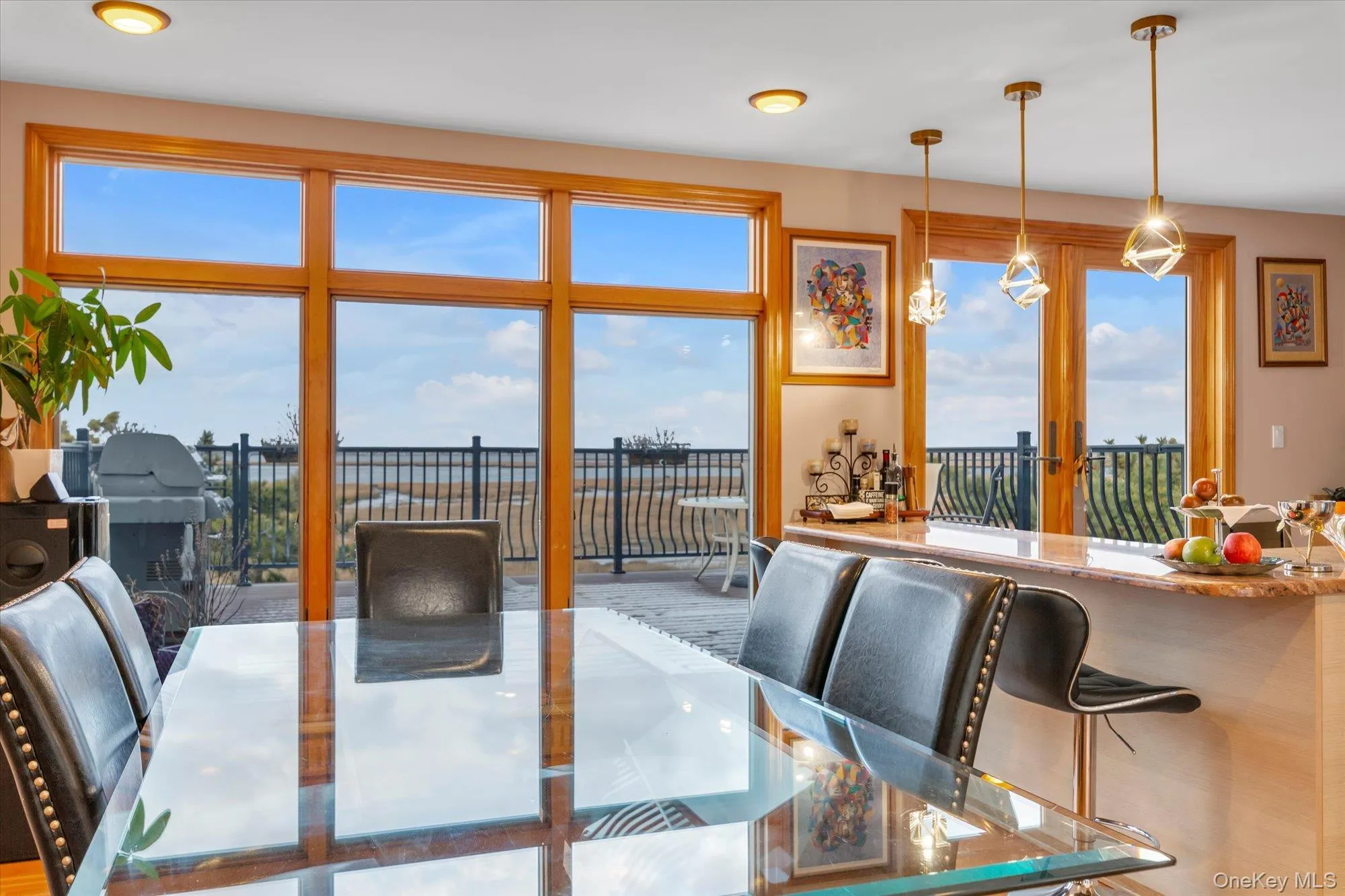 Dining area featuring water views and outside deck Dining area featuring water views and outside deck