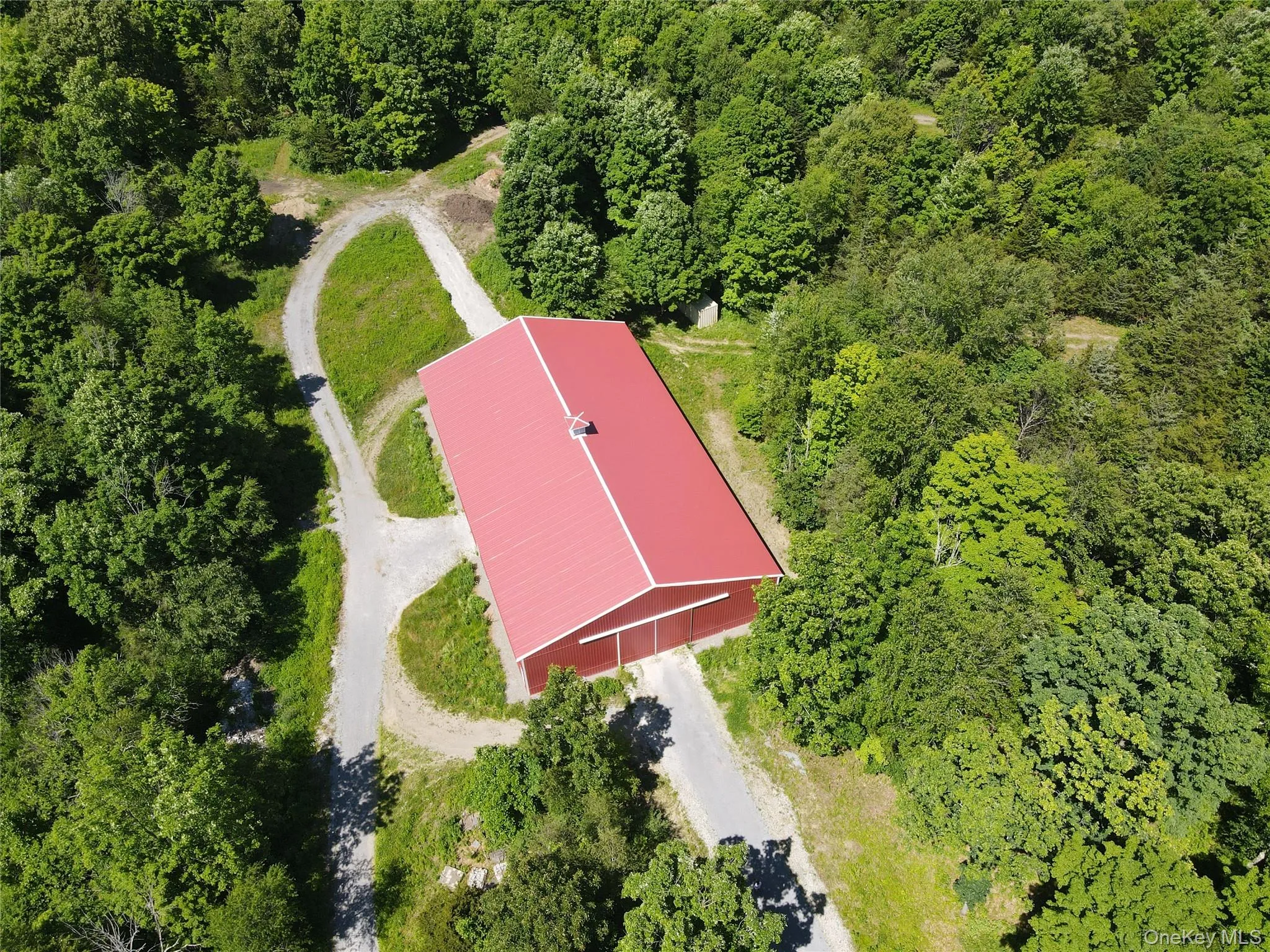 Large storage barn or possible indoor riding ring Large storage barn or possible indoor riding ring