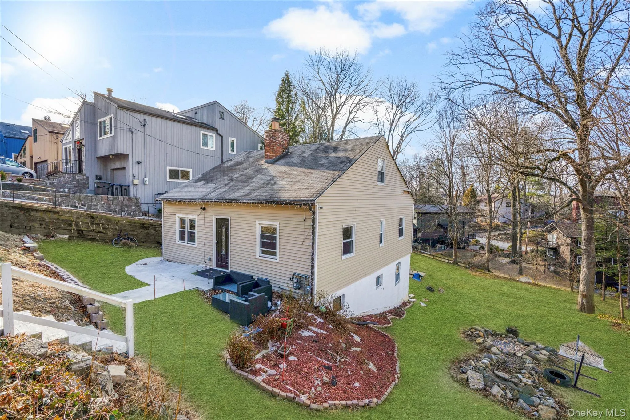 Rear view of property featuring outdoor lounge area, a lawn, and a patio Rear view of property featuring outdoor lounge area, a lawn, and a patio