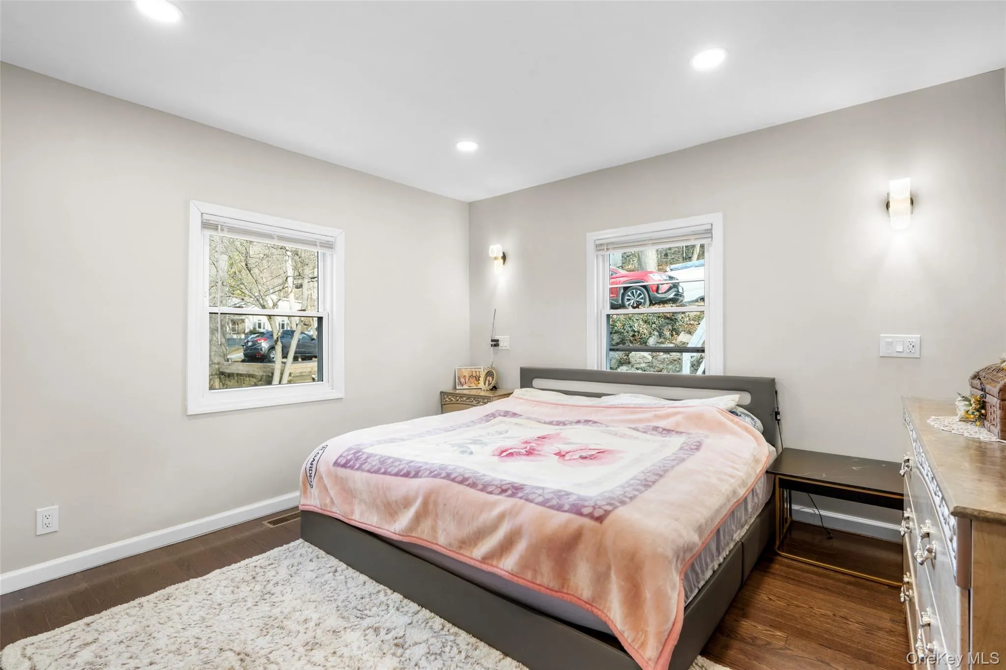 Bedroom featuring dark hardwood / wood-style floors Bedroom featuring dark hardwood / wood-style floors