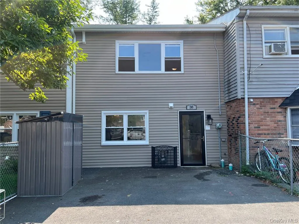 View of property with a driveway and a shed. View of property with a driveway and a shed.