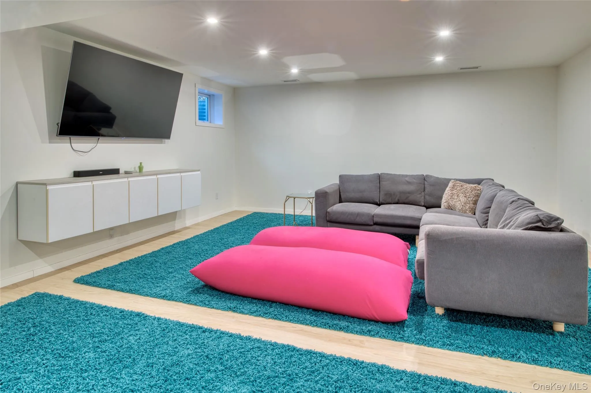 Living room featuring light hardwood / wood-style flooring Living room featuring light hardwood / wood-style flooring