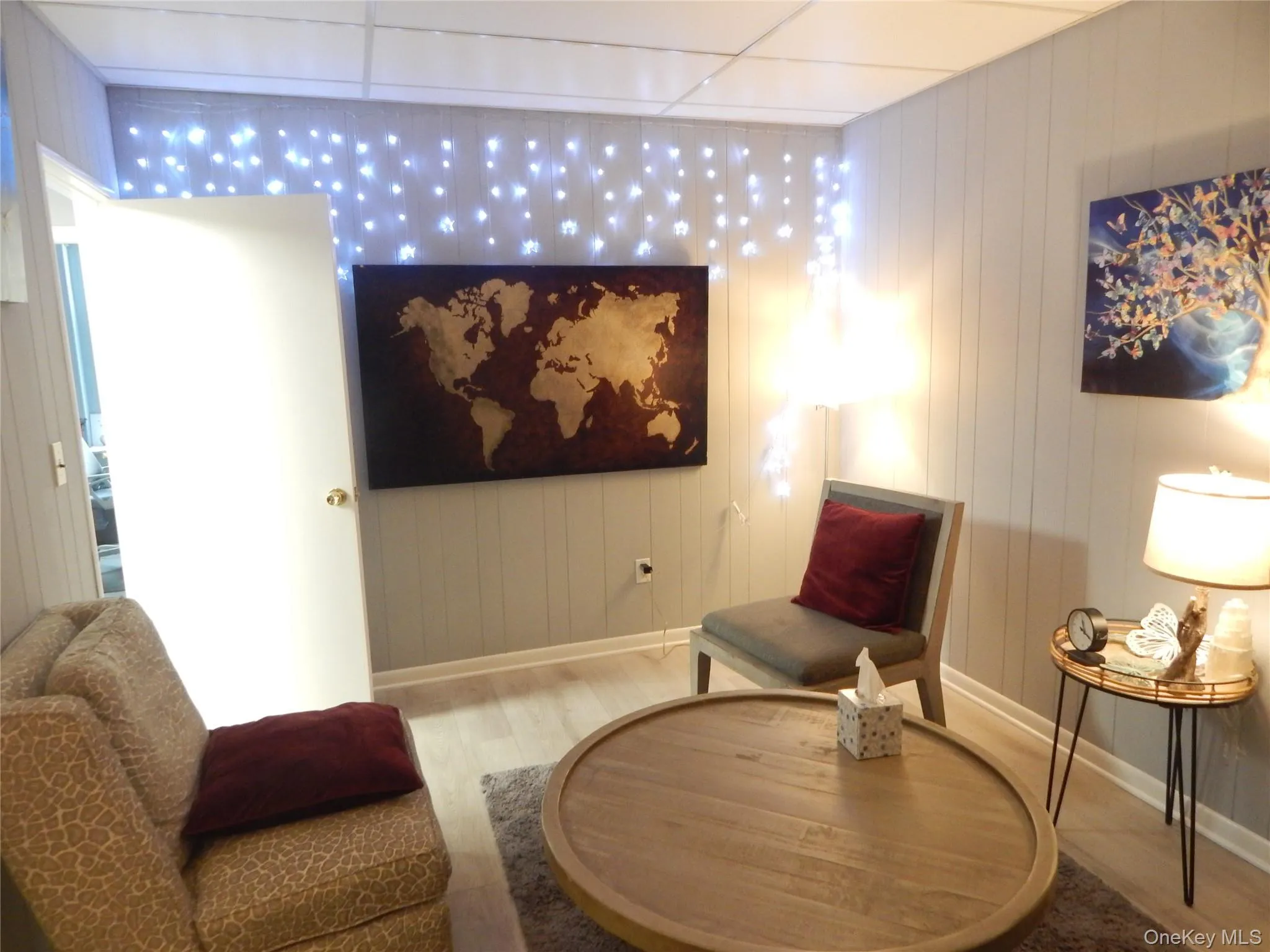 Sitting room with light wood-type flooring Sitting room with light wood-type flooring