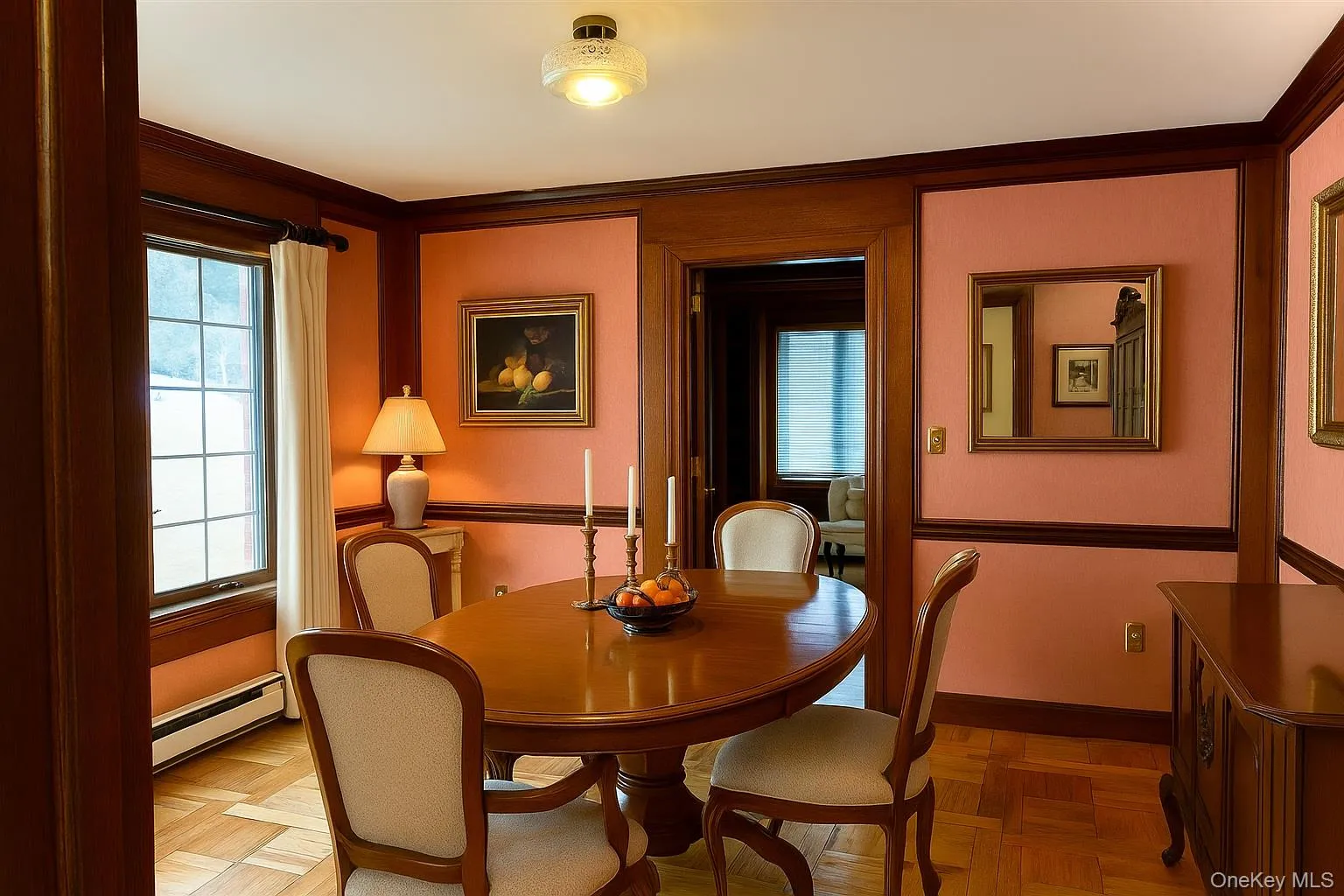 Dining room featuring a baseboard radiator and ornamental molding Dining room featuring a baseboard radiator and ornamental molding