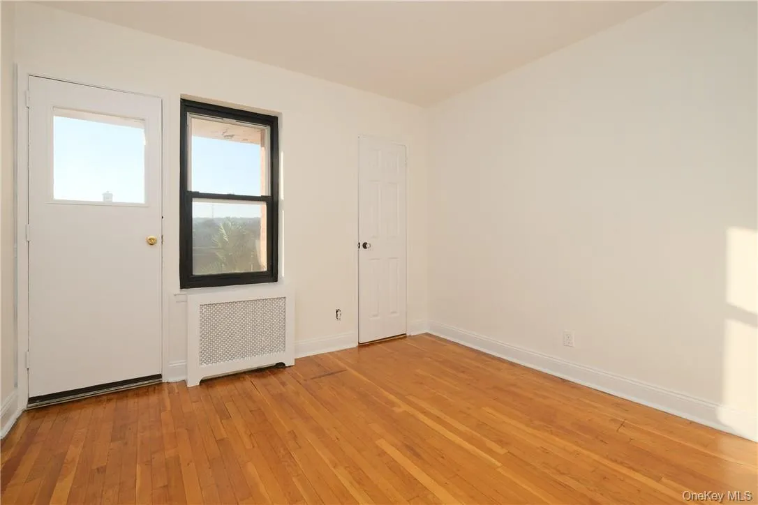Apt. 5F - Second Bedroom facing west w/ closet, door to private Balcony & Hudson River / Palisades view. Apt. 5F - Second Bedroom facing west w/ closet, door to private Balcony & Hudson River / Palisades view.