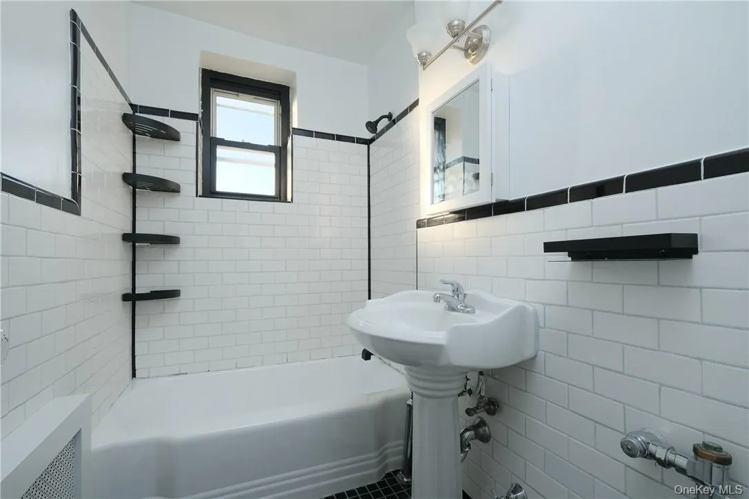 APT. 5F - (4) piece windowed Primary Bath, w/ west exposure. APT. 5F - (4) piece windowed Primary Bath, w/ west exposure.