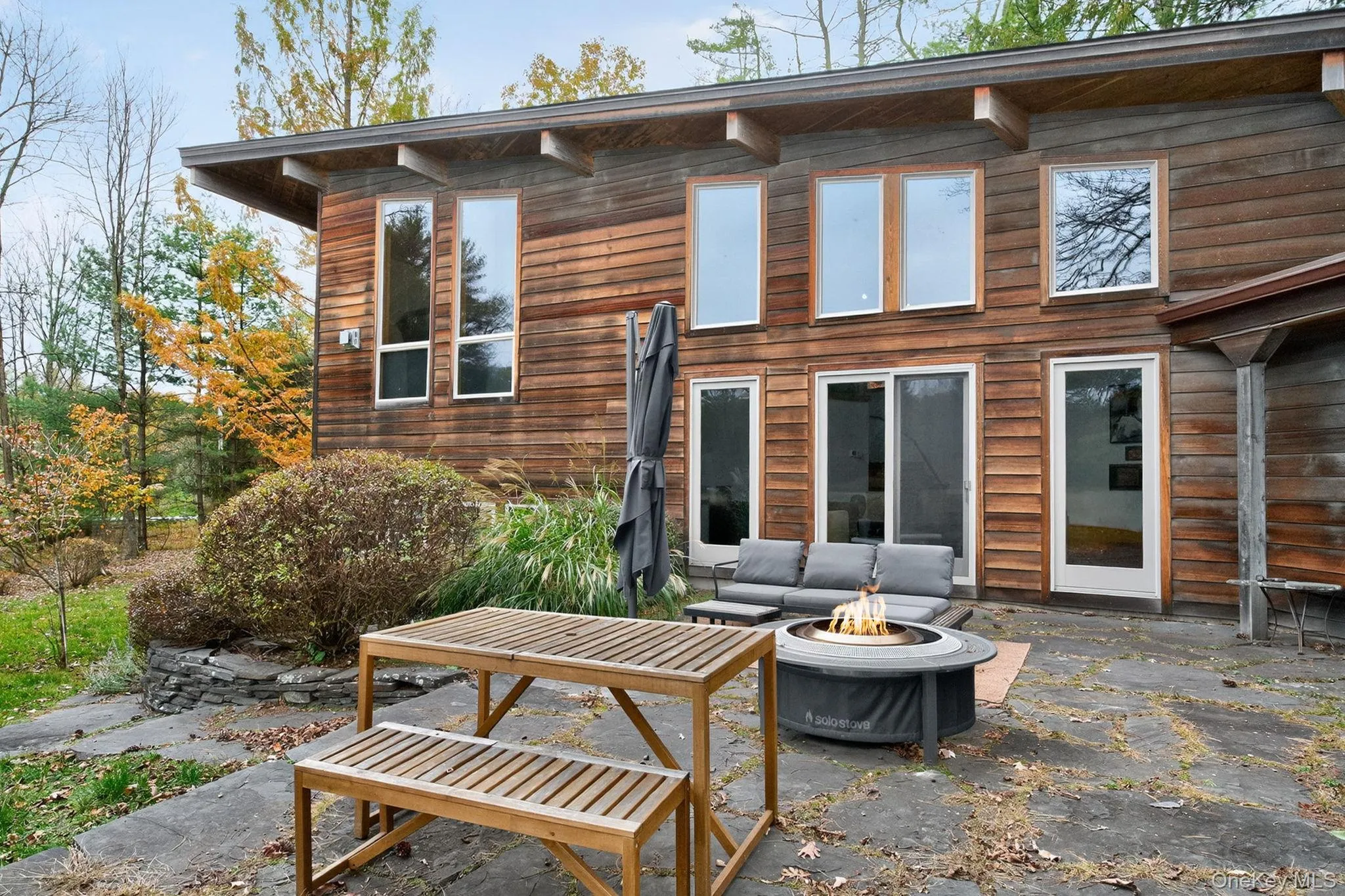 Expansive stone patio backyard overlooking view. Expansive stone patio backyard overlooking view.