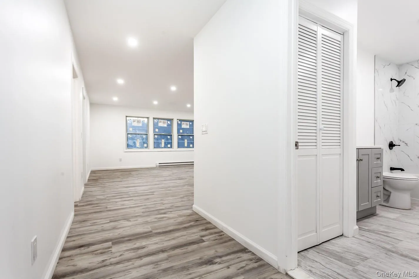 with full bathroom to the right going to kitchen/ living area with full bathroom to the right going to kitchen/ living area