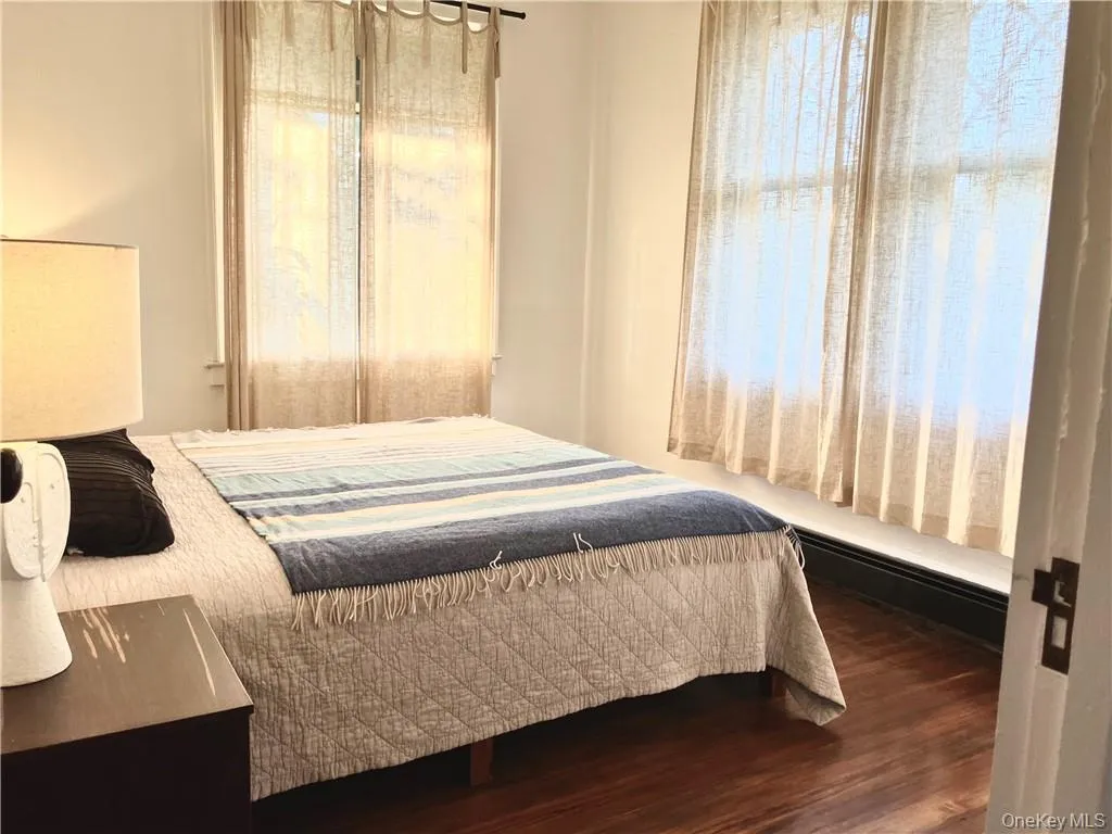 Bedroom with hardwood / wood-style flooring Bedroom with hardwood / wood-style flooring