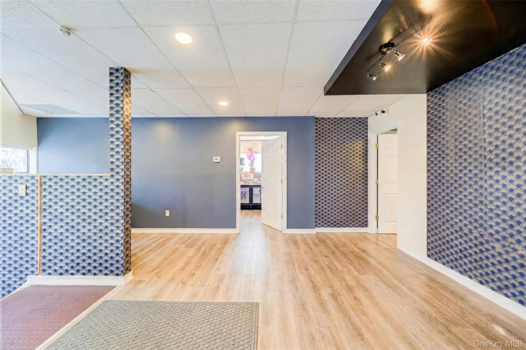 2nd Floor Reception Digitally staged to illustrate space when vacated. 2nd Floor Reception Digitally staged to illustrate space when vacated.