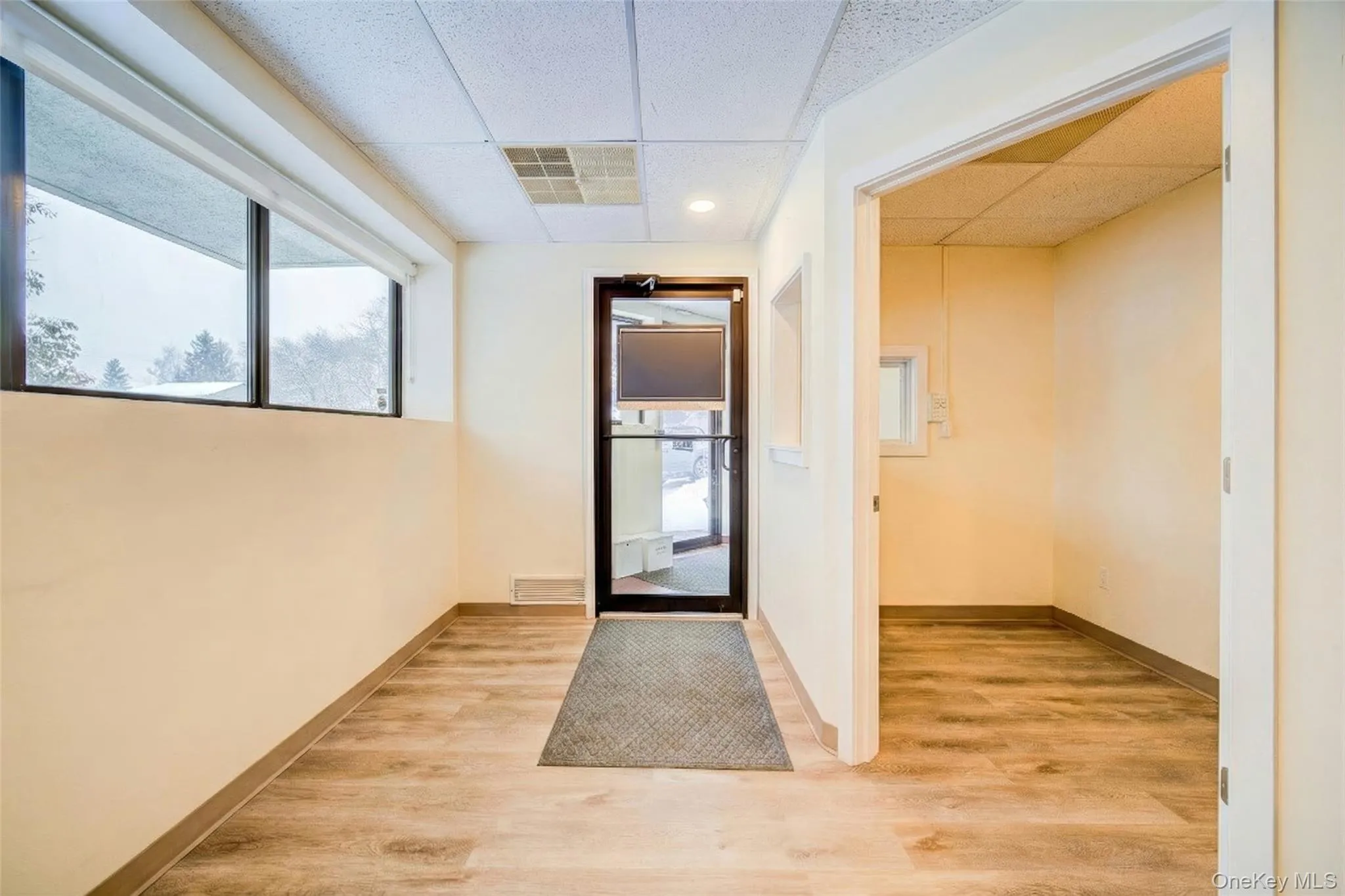 1st Floor entrance: Digitally staged to illustrate space when vacated. 1st Floor entrance: Digitally staged to illustrate space when vacated.