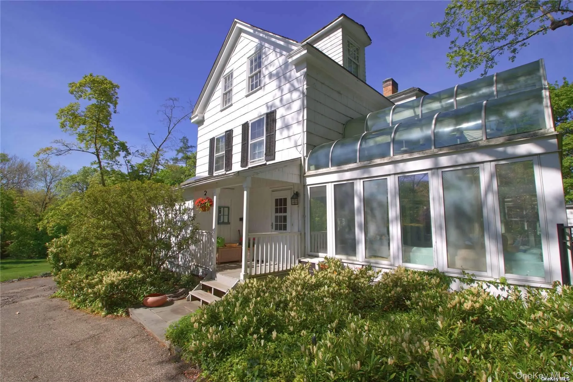 Side porch, driveway access Side porch, driveway access
