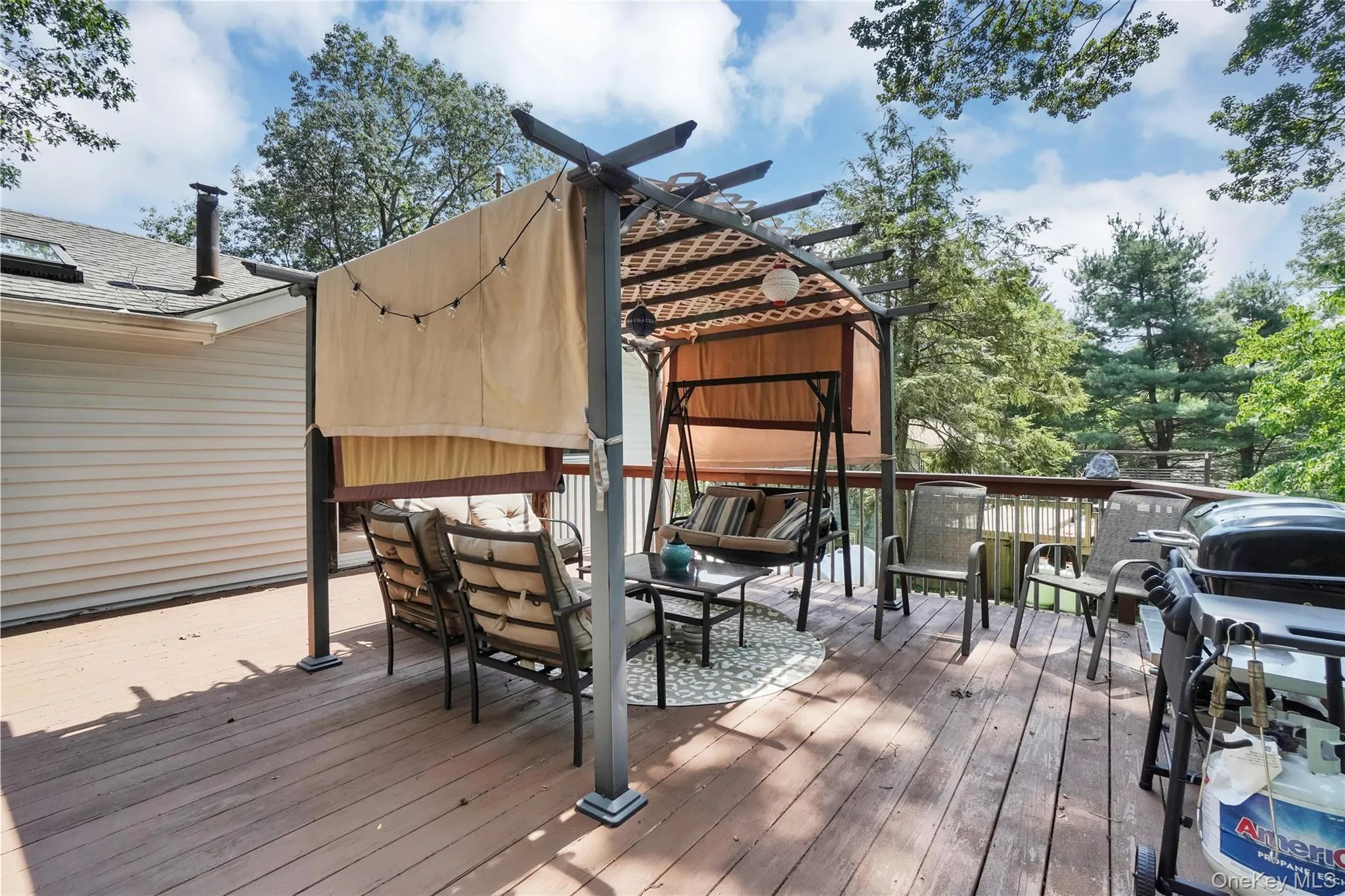 Wooden deck featuring a pergola Wooden deck featuring a pergola