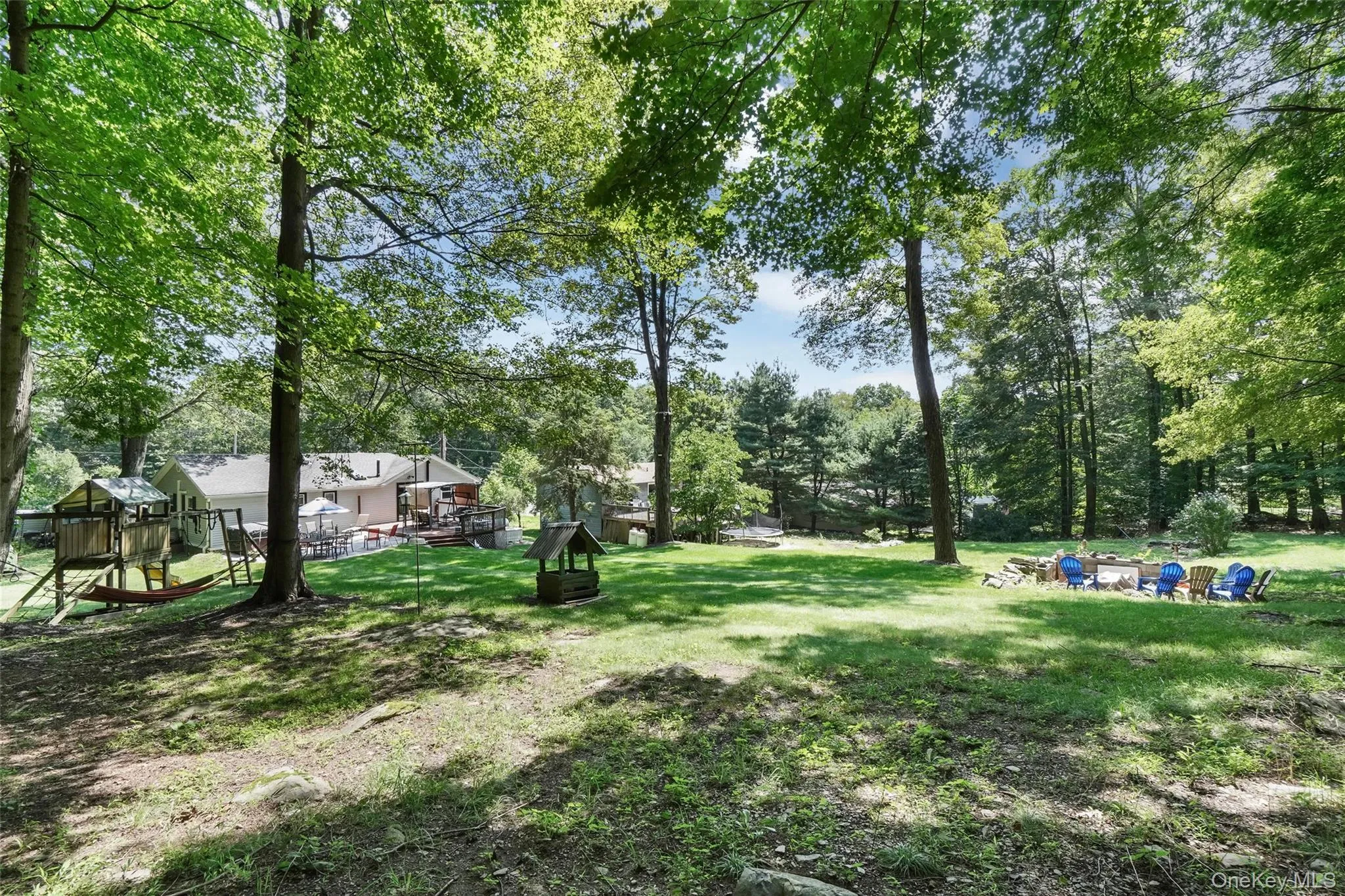 View of grassy yard with view of scattered trees View of grassy yard with view of scattered trees