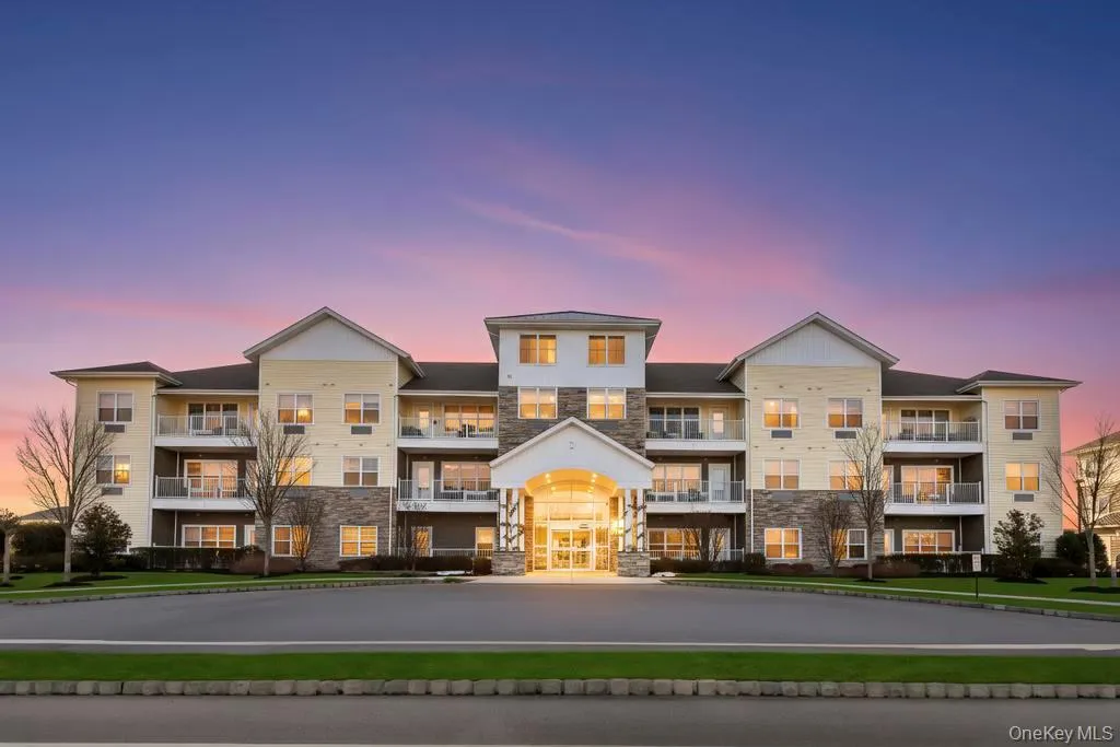 Property at dusk with a view of apartment building / complex Property at dusk with a view of apartment building / complex