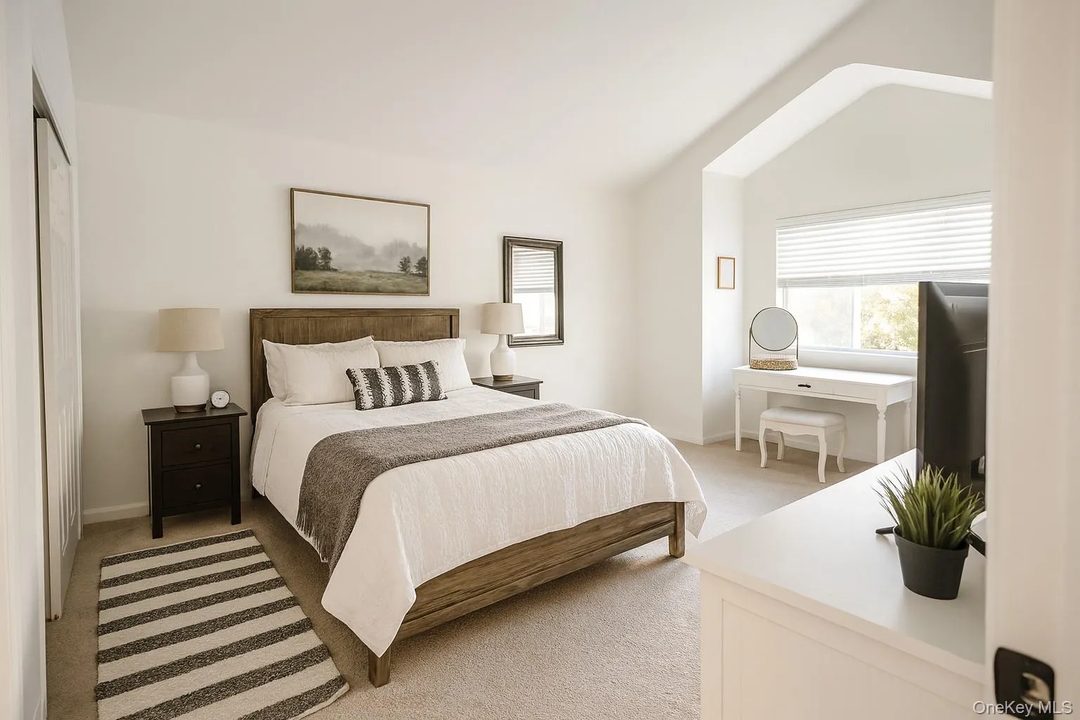 Extremely spacious and bright primary bedroom suite which features a vaulted ceiling, 2 oversized double closets, and a private shower stall bathroom (virtually staged) Extremely spacious and bright primary bedroom suite which features a vaulted ceiling, 2 oversized double closets, and a private shower stall bathroom (virtually staged)