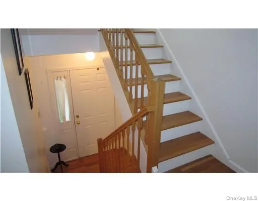There are stairs leading upstairs to the bedroom level. (Actual stairs are carpeted floating stairs) There are stairs leading upstairs to the bedroom level. (Actual stairs are carpeted floating stairs)