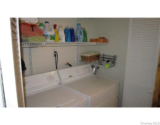 Full sized washer and dryer with storage above Full sized washer and dryer with storage above