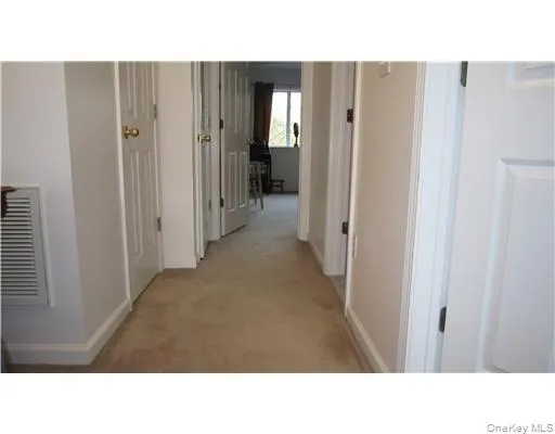 Upstairs hallway leading to bedrooms which are located to allow for privacy - on opposite sides of the floor Upstairs hallway leading to bedrooms which are located to allow for privacy - on opposite sides of the floor