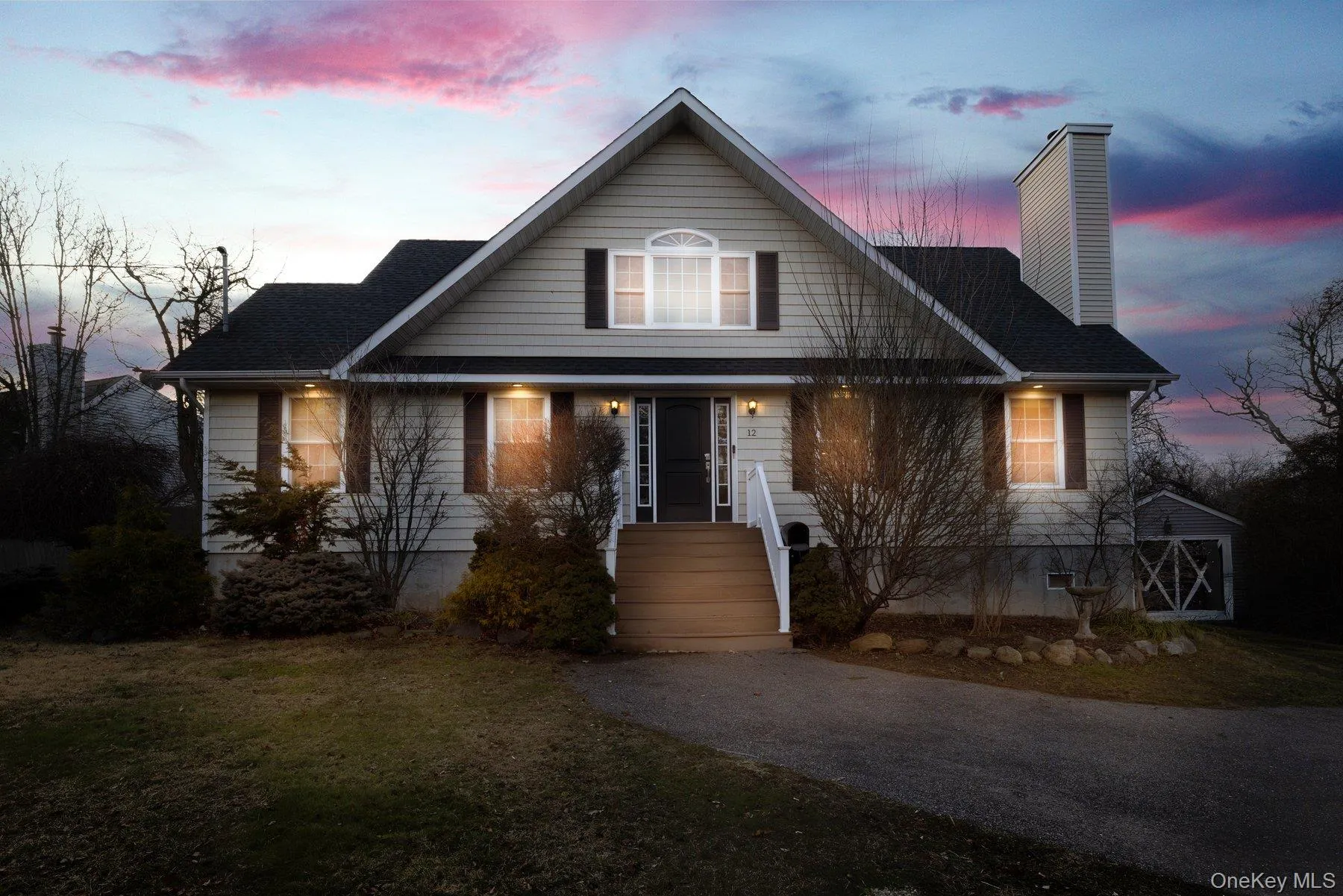 View of front of house featuring a chimney, a front yard, and an outdoor structure View of front of house featuring a chimney, a front yard, and an outdoor structure