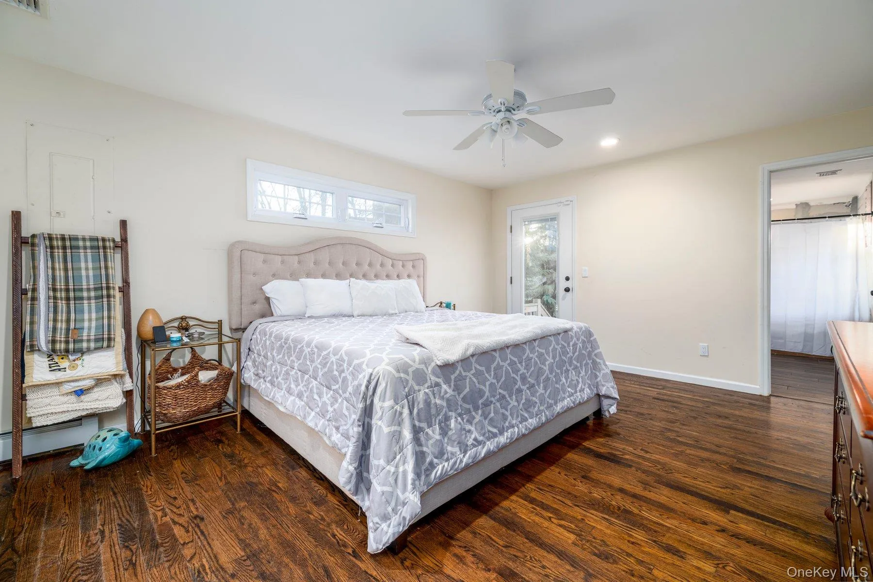 Bedroom featuring dark wood-type flooring, ceiling fan, recessed lighting, and access to exterior Bedroom featuring dark wood-type flooring, ceiling fan, recessed lighting, and access to exterior