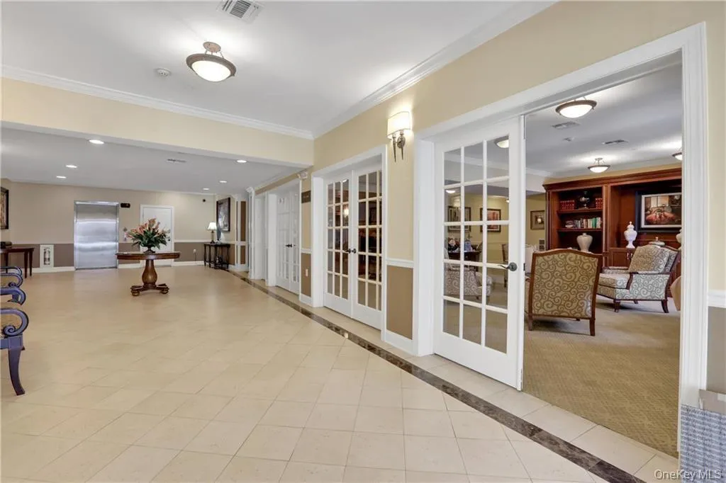 Building lobby with crown molding and recessed lighting Building lobby with crown molding and recessed lighting